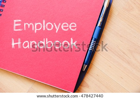 Employee handbook text concept write on notebook Royalty-Free Stock Photo #478427440