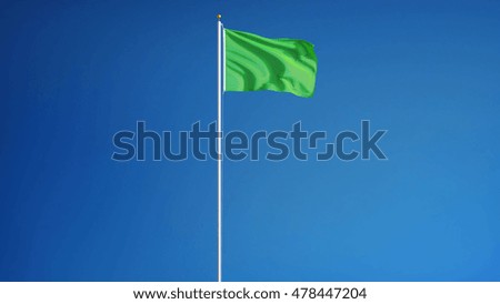 Light green flag waving against clean blue sky, long shot, isolated with clipping path mask alpha channel transparency