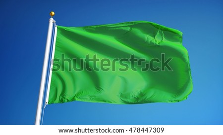 Light green flag waving against clean blue sky, close up, isolated with clipping path mask alpha channel transparency
