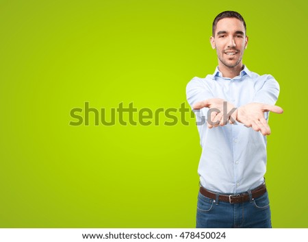 Businessman show gesture on green background
