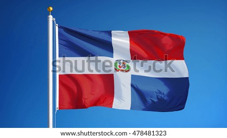 Dominican Republic flag waving against clean blue sky, close up, isolated with clipping path mask alpha channel transparency