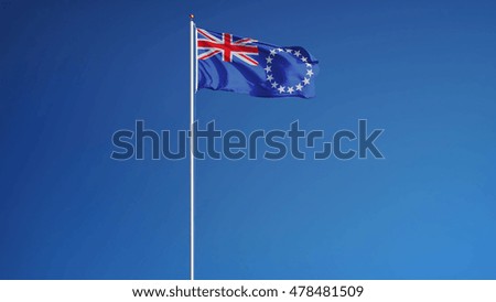Cook Islands flag waving against clean blue sky, long shot, isolated with clipping path mask alpha channel transparency