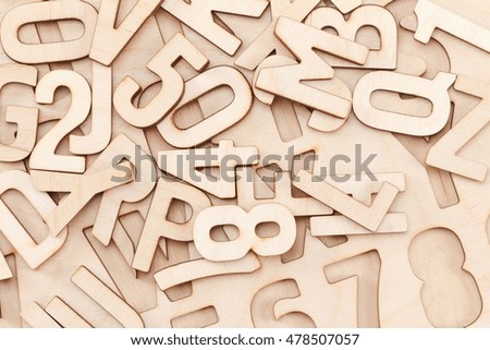 Back to school concept. Alphabet made of wooden letters, background
