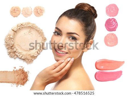 Beautiful young woman with makeup products samples on white background. Beauty treatment concept.
