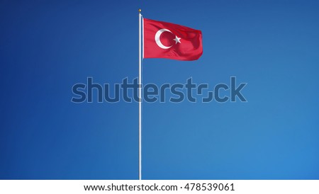 Turkey flag waving against clean blue sky, long shot, isolated with clipping path mask alpha channel transparency