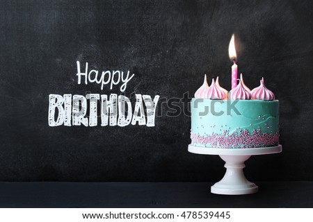 Birthday cupcake in front of a chalkboard