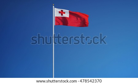 Tonga flag waving against clean blue sky, long shot, isolated with clipping path mask alpha channel transparency