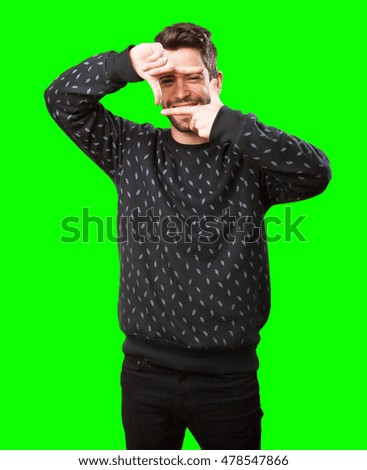 young man doing a frame gesture