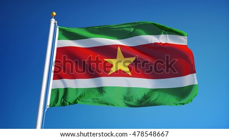 Suriname flag waving against clean blue sky, close up, isolated with clipping path mask alpha channel transparency
