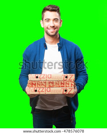 young man holding pizzas