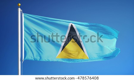 Saint Lucia flag waving against clean blue sky, close up, isolated with clipping path mask alpha channel transparency