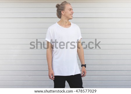 Handsome guy with white hair standing in the white blank t-shirt