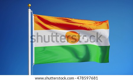 Niger flag waving against clean blue sky, close up, isolated with clipping path mask alpha channel transparency
