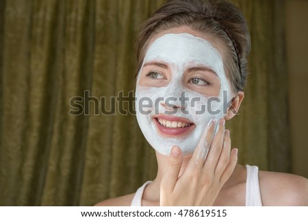 Girl taking care of her complexion layering moisturizer