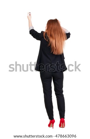 back view of writing beautiful redhead business woman. Young girl in suite draws. Rear view people collection. backside view of person. Isolated over white background