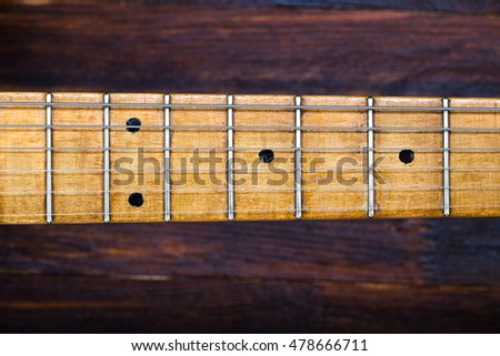 guitar fretboard and  strung strings - element of vintage musical instrument Royalty-Free Stock Photo #478666711