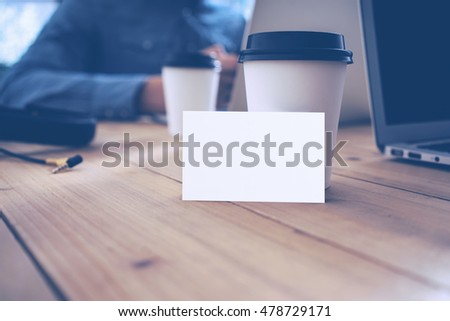 Blank White Business Card Mockup Wood Table Take Away Coffee Cup.Adult Businessman Work Modern Notebook Office Blurred Background.Clean Object Ready Private Corporate Information.Horizontal Mock Up