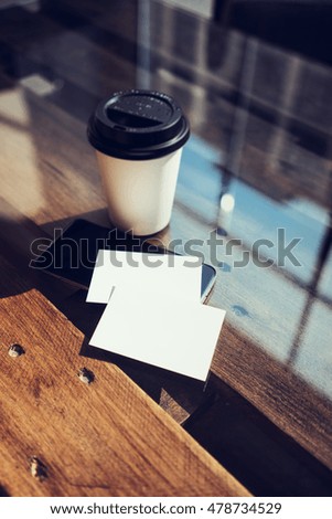 Two Blank White Business Card Mockup Wood Table Take Away Coffee Cup Coworking.Modern Phone Ready Work Office Glass Background.Clean Object Private Corporate Information.Vertical Hot Drinks Mock Up