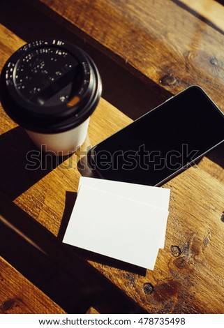 Blank White Business Card Mockup.Mobile Phone High Textured Wood Table Take Away Coffee Cup Cafe.Ready Work Modern Office Blurred Background.Clean Object Private Corporate Information Vertical.Mock Up