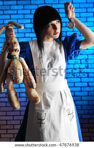 Portrait of a young woman dressed as Alice in Wonderland, video game.