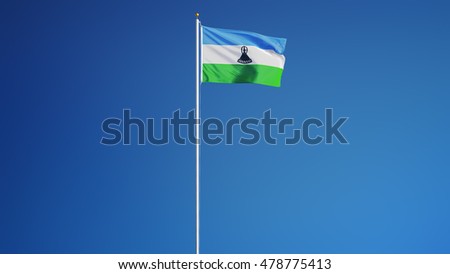 Lesotho flag waving against clean blue sky, long shot, isolated with clipping path mask alpha channel transparency
