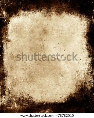 Halloween grunge orange abstract texture background with black scratched frame and faded central area for your text or picture.  
