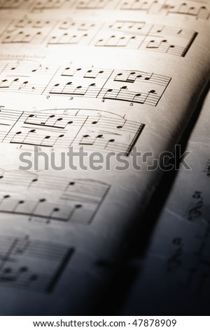 Closeup of old music sheet, dual-toned.