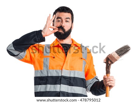 Garbage man making silence gesture