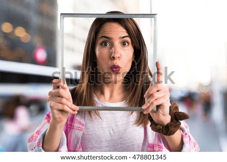 Young girl with framework on unfocused background