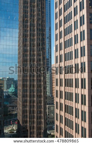 Street view with skyscrapers reflected in glass in the City Center of Philadelphia, Pennsylvania, USA.
