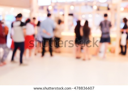 blurred people in shopping mall.