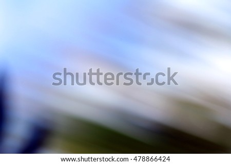 Stock Photo - Abstract light blur through the leaves of the tree crown image background pattern texture wallpaper