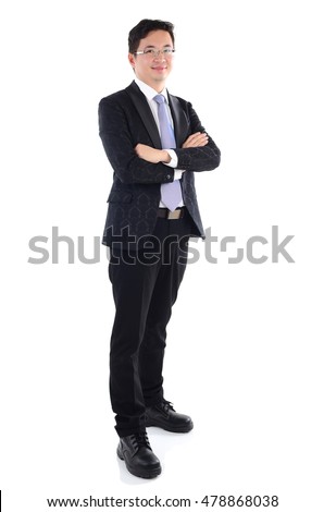 Confident Southeast Asian businessman crossed arms over white background Royalty-Free Stock Photo #478868038