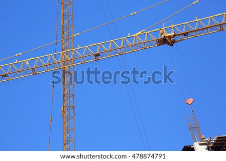 abstract image, part of arm machinery construction crane with blue sky background