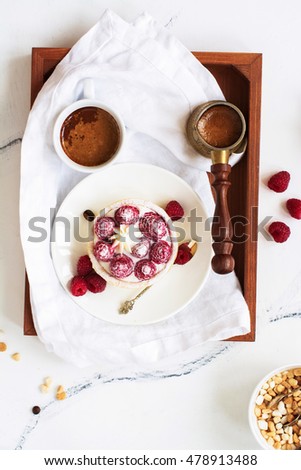 Morning breakfast with small berry tarts and coffee. Top view. Space for text