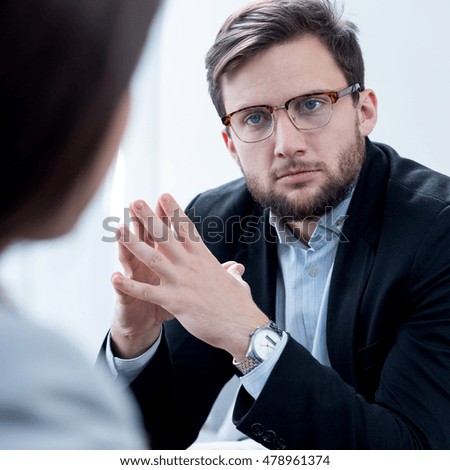 Photo of male therapist helping woman with depression