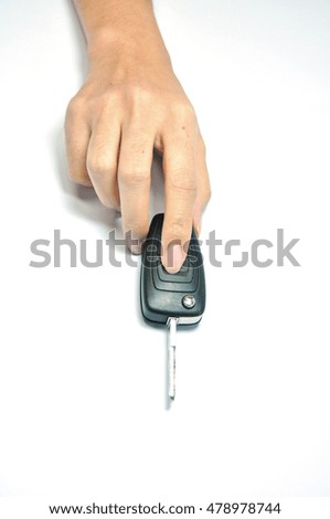 Female hand holds car key