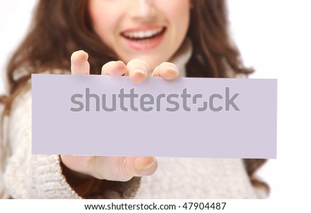 Young woman holding an empty billboard over white background