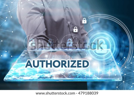 Business, Technology, Internet and network concept. Young businessman working on a tablet of the future, he sees the inscription: Authorized