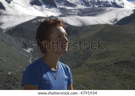 Dreaming girl with mountains as a background