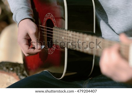 play on guitar