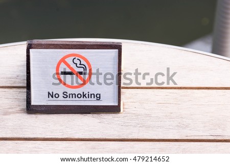 no smoking sign on the table