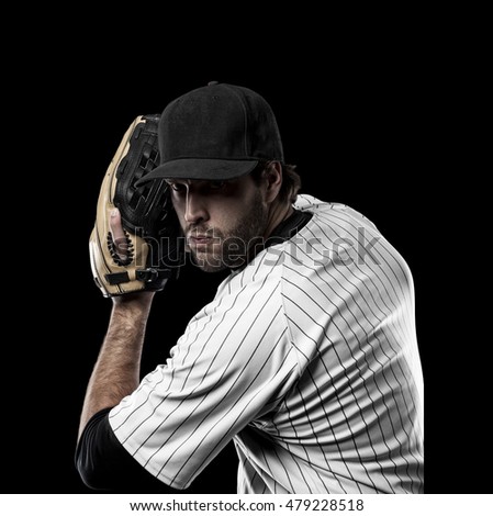 Pitcher Baseball Player with a white uniform on a black background.