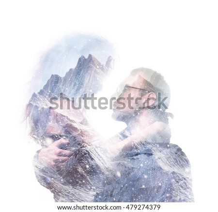 Double exposure portrait of a couple looking at each other with love and passion, hugging. Combined with photograph of mountains. Romance and people concept