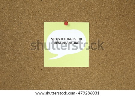 The phrase Storytelling is the best Marketing on a green sticky note posted to a cork notice board
