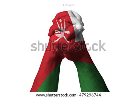Man clasped hands patterned with the OMAN flag