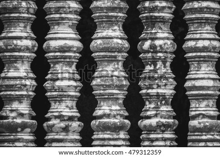 Black and white of pillars at the Angkor Wat temple complex in Siem Reap, Cambodia.