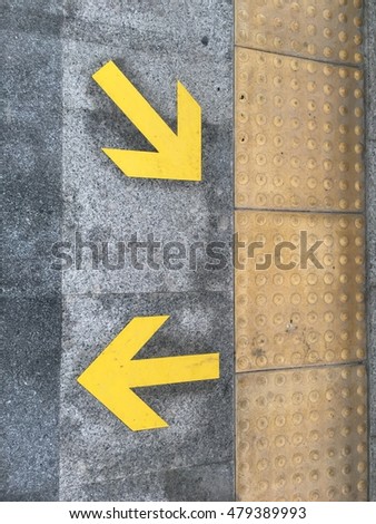 Arrow direction sign on the ground of metro station in Nonthaburi, Thailand