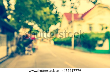 Image of Abstract blur road on day time for background usage . (vintage tone)