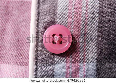Button on a shirt close up Royalty-Free Stock Photo #479420536